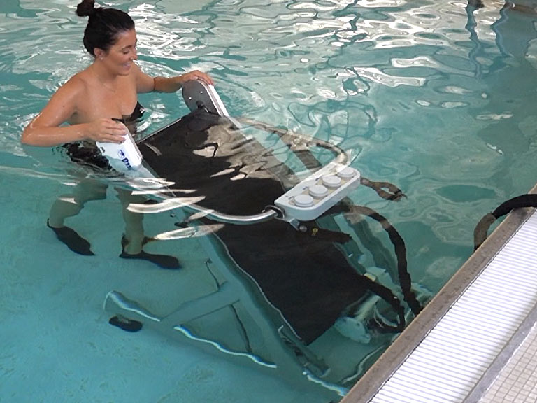Otter treadmill is lowered into a pool
